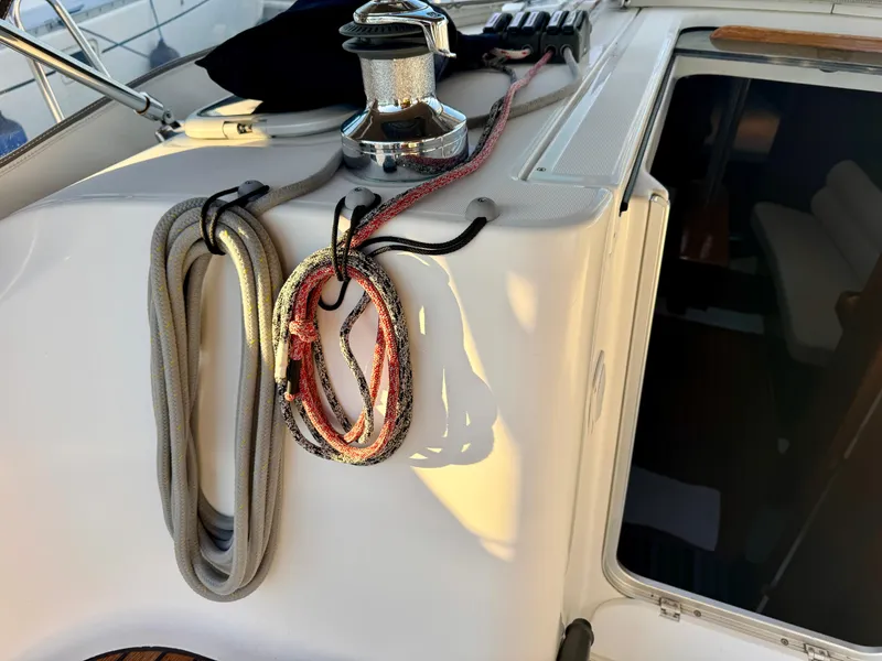 Slide: The Image of 2006 Beneteau Oceanis Clipper 343 yacht deck with ropes and winch. - 40
