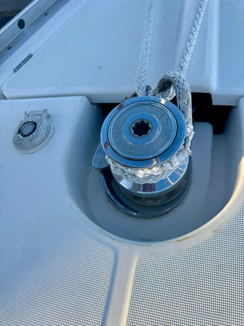 Slide: The Image of Winch on 2006 Beneteau Oceanis Clipper 343 sailboat deck with rope. - 42