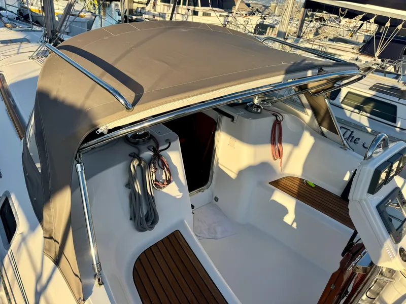 Slide: The Image of 2006 Beneteau Oceanis Clipper 343 cockpit with canopy and wooden seating. - 6