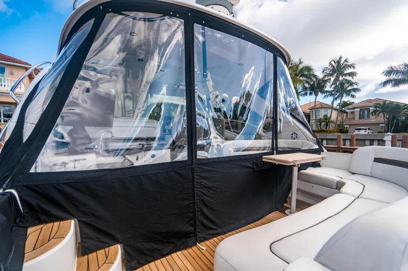 Slide: The Image of Luxurious interior of 2005 Sea Ray 48 Sundancer yacht with kitchen and seating area. - 21