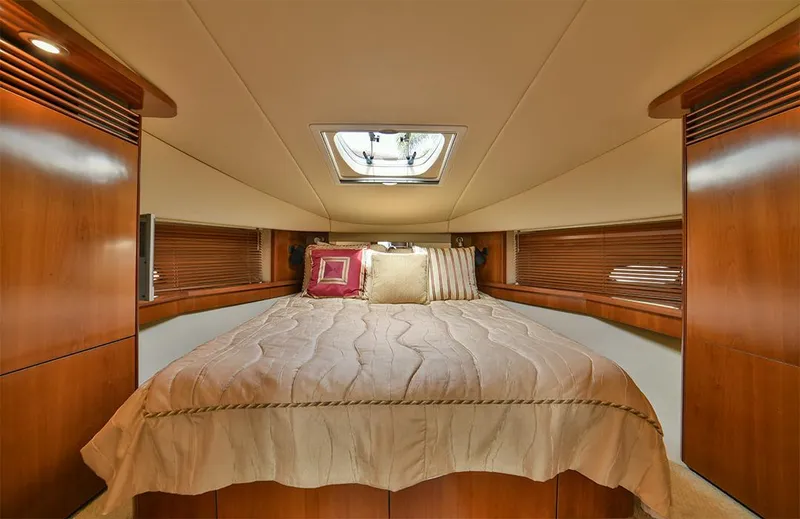 Slide: The Image of Luxurious interior of 2005 Sea Ray 48 Sundancer yacht with wood finishes and modern kitchen. - 23