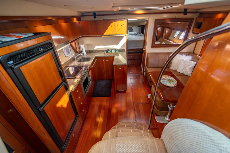 Slide: The Image of Luxurious interior of 2005 Sea Ray 48 Sundancer yacht with modern kitchen amenities. - 24