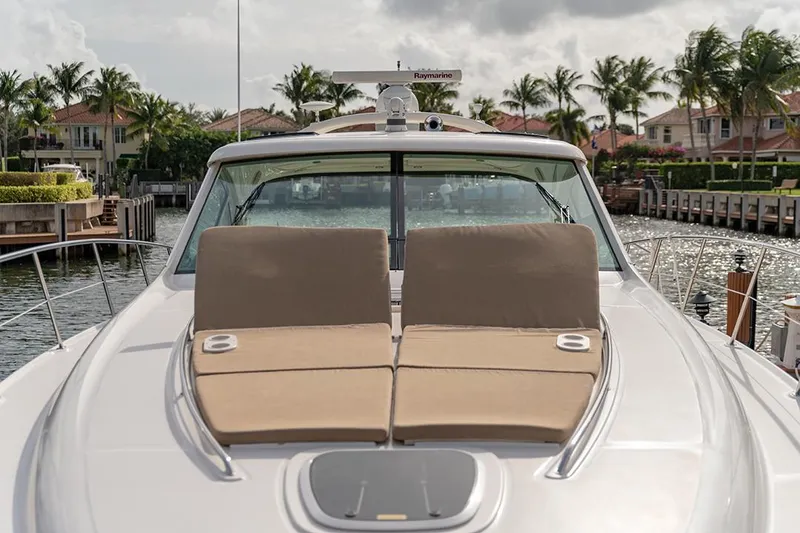 Slide: The Image of Luxurious 2005 Sea Ray 48 Sundancer yacht kitchen with wood cabinetry and modern appliances. - 26