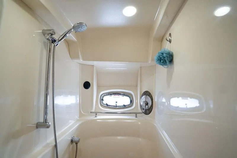 Slide: The Image of Luxurious bathroom in 2005 Sea Ray 48 Sundancer yacht with shower and porthole. - 29