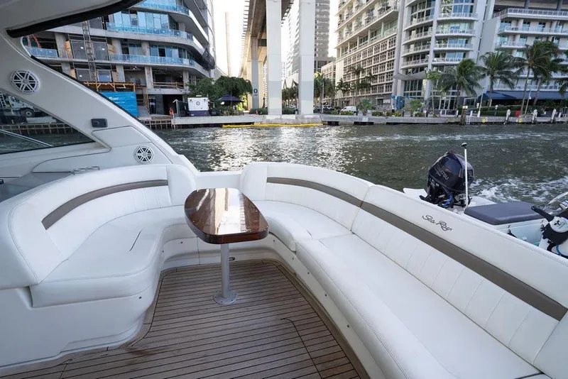 Slide: The Image of Luxurious 2005 Sea Ray 48 Sundancer yacht with elegant seating and waterfront city view. - 35