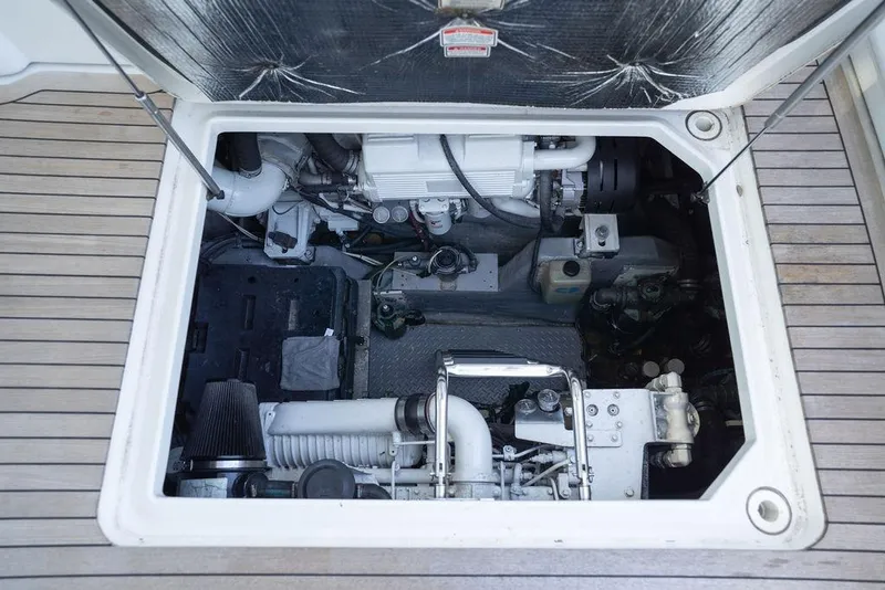 Slide: The Image of Engine compartment of 2005 Sea Ray 48 Sundancer yacht, showcasing mechanical components. - 47