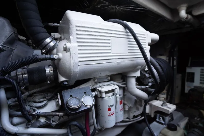 Slide: The Image of Engine compartment of a 2005 Sea Ray 48 Sundancer yacht, showcasing mechanical components. - 48