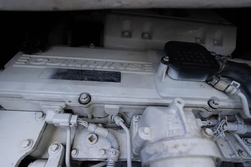 Slide: The Image of Engine compartment of a 2005 Sea Ray 48 Sundancer with Cummins branding. - 52