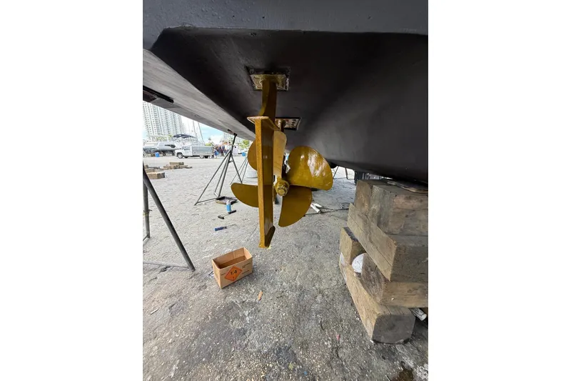 Slide: The Image of Propeller of 2005 Sea Ray 48 Sundancer yacht on dry dock, showcasing maintenance setup. - 57
