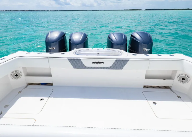 Slide: The Image of 2020 Invincible 37 Catamaran with four engines on turquoise water. - 24