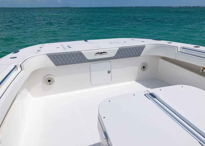 Slide: The Image of 2020 Invincible 37 Catamaran deck with ocean view, featuring spacious seating and storage. - 7