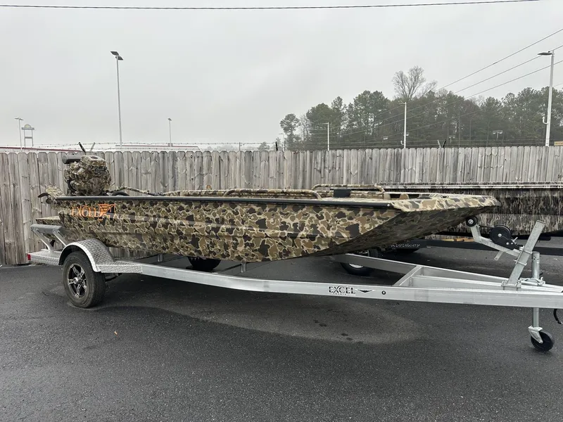Slide: The Image of 2025 Excel Shallow Water F4 1754 boat with camo paint on a trailer. - 1