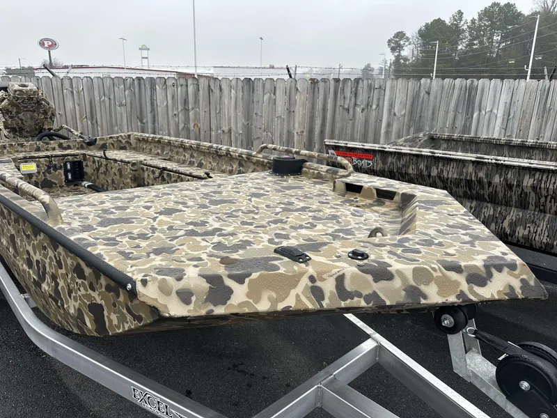 Slide: The Image of 2025 Excel Shallow Water F4 boat with camouflage paint on a trailer. - 7