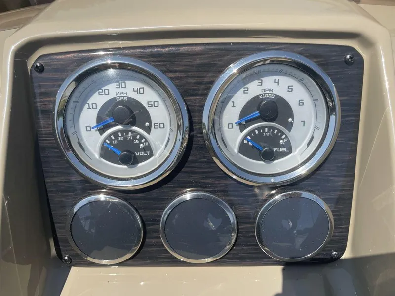 Slide: The Image of Dashboard of 2024 Sylvan 822 LZ Mirage with speedometer and fuel gauge. - 10
