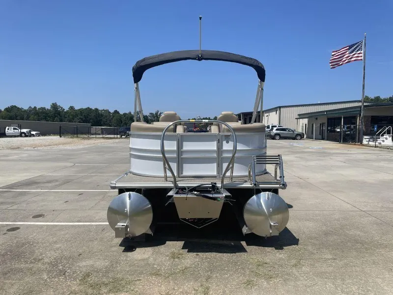 Slide: The Image of 2024 Sylvan 822 LZ Mirage pontoon boat on concrete lot with American flag. - 4