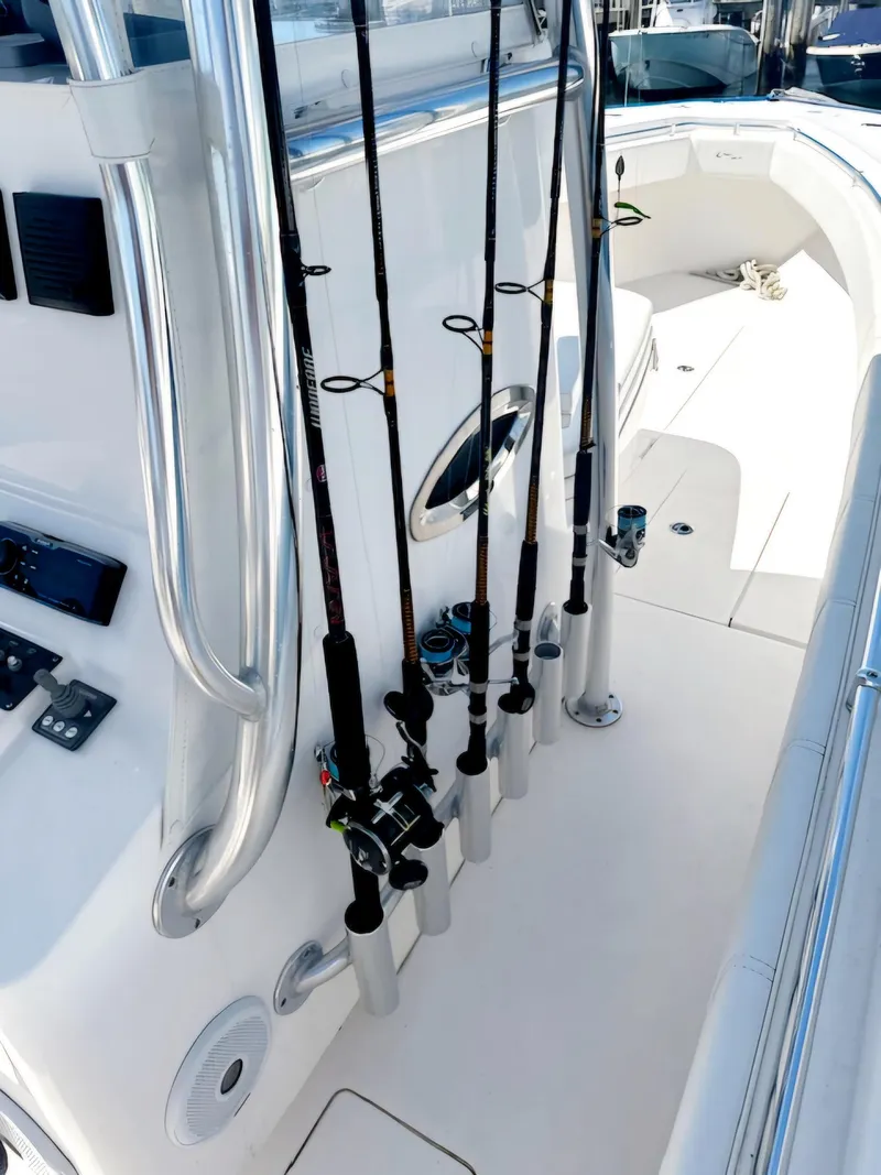 Slide: The Image of 2016 Contender 32 ST boat with fishing rods in holders on deck. - 12