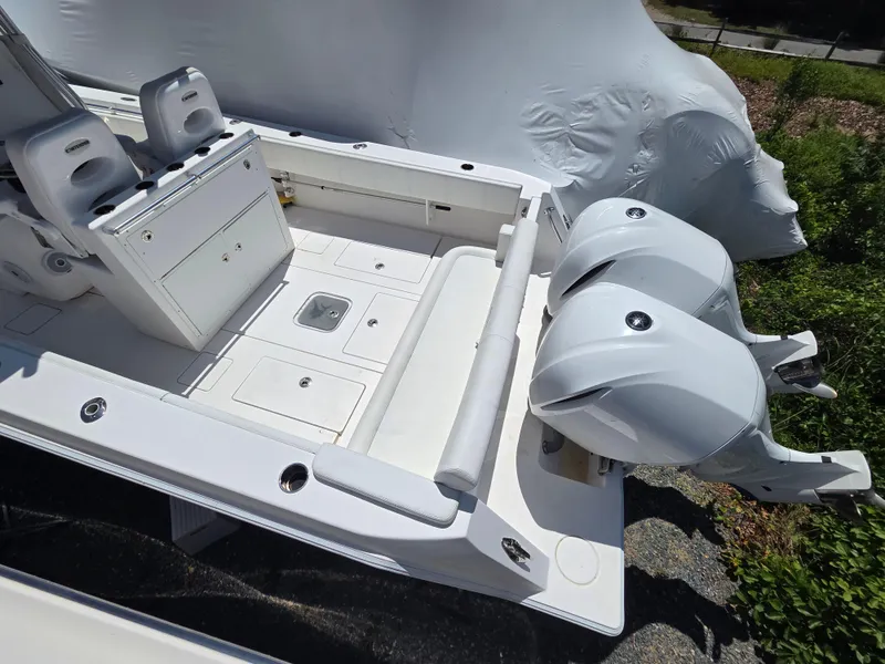 Slide: The Image of 2016 Contender 32 ST boat with dual outboard engines and spacious deck layout. - 8