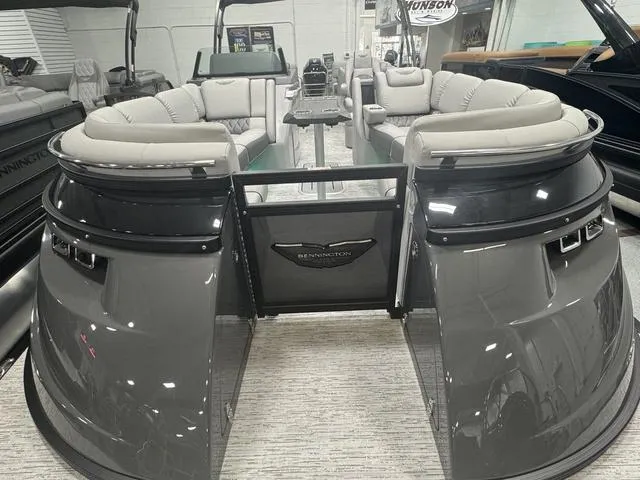 Slide: The Image of 2025 Bennington Q Quad Bench 25 QFB pontoon boat with luxurious seating and sleek design. - 10