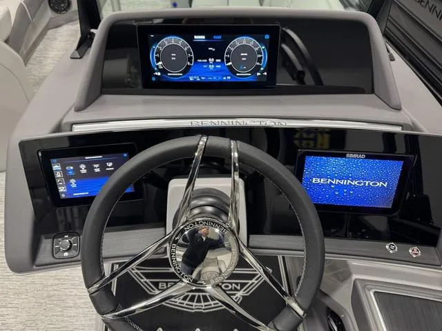 Slide: The Image of Steering console of 2025 Bennington Q Quad Bench 25 QFB with digital displays. - 17
