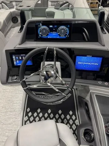 Slide: The Image of 2025 Bennington Q Quad Bench 25 QFB boat dashboard with modern controls and digital displays. - 19