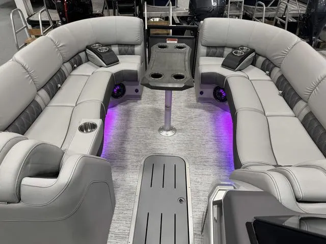 Slide: The Image of Luxurious 2025 Bennington Q Quad Bench 25 QFB pontoon boat interior with ambient lighting. - 21