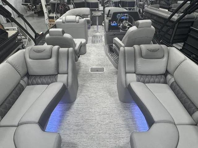 Slide: The Image of 2025 Bennington Q Quad Bench 25 QFB interior with luxurious seating and ambient lighting. - 28