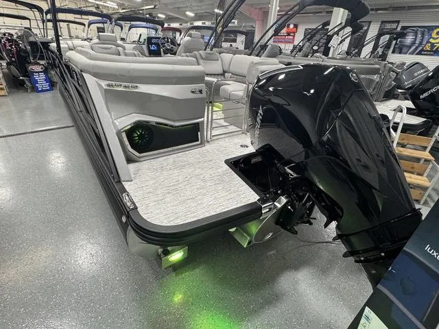 Slide: The Image of 2025 Bennington Q Quad Bench 25 QFB boat with sleek design and powerful engine. - 30