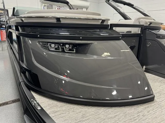 Slide: The Image of 2025 Bennington Q Quad Bench 25 QFB pontoon boat with sleek gray design. - 7