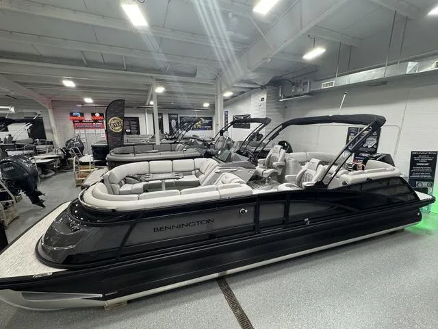 Slide: The Image of 2025 Bennington Q Quad Bench 25 QFB pontoon boat in showroom display. - 8