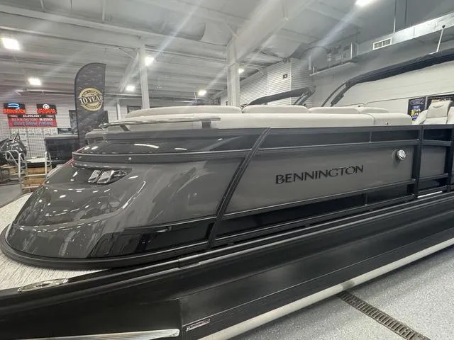 Slide: The Image of 2025 Bennington Q Quad Bench 25 QFB pontoon boat in showroom, sleek design, gray color. - 9