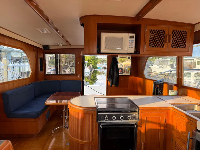 Slide: The Image of Interior of 1988 Hi-Star 44 Convertible yacht with kitchen and seating area. - 6
