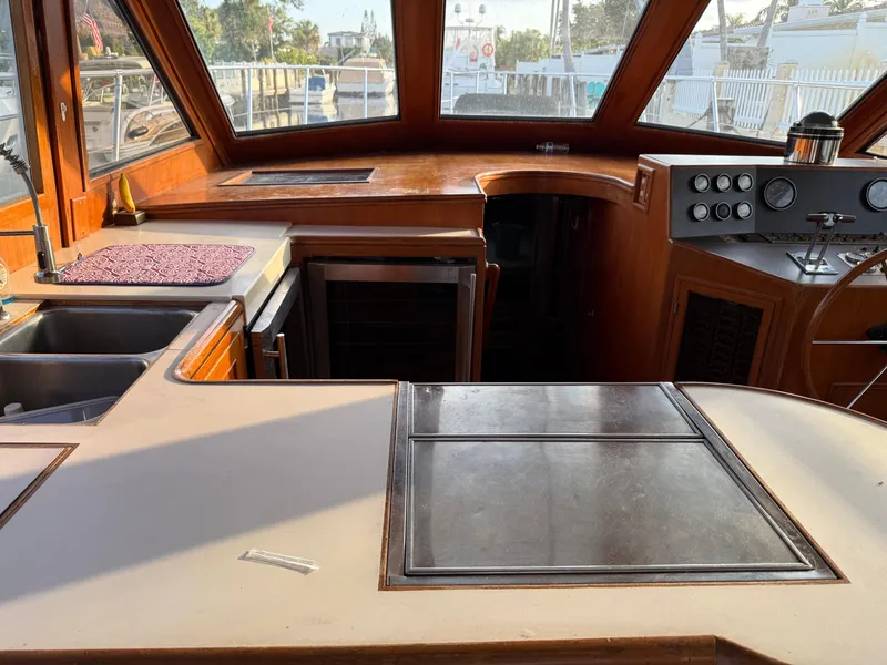 Slide: The Image of Interior of 1988 Hi-Star 44 Convertible yacht with kitchen and control panel. - 8