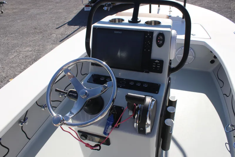 Slide: The Image of Xplor X7 2022 boat console with steering wheel and navigation display. - 10