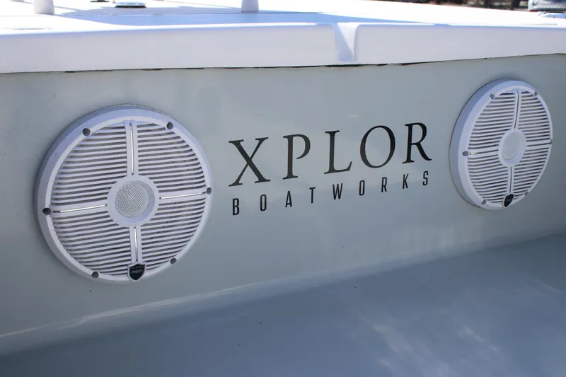 Slide: The Image of Xplor X7 2022 boat with dual speakers and logo on the side. - 2