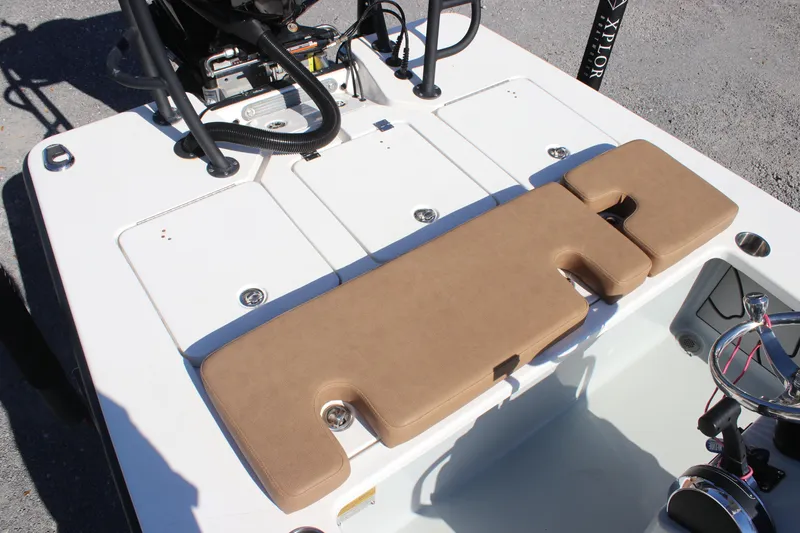 Slide: The Image of 2022 Xplor X7 boat deck with tan seating and storage compartments. - 3