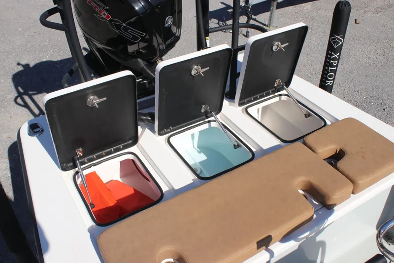 Slide: The Image of Open storage compartments on 2022 Xplor X7 boat, featuring colorful interiors and seating. - 6