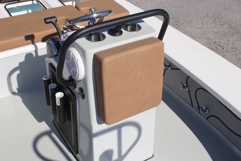 Slide: The Image of Center console of 2022 Xplor X7 boat with cushioned seat and steering controls. - 8