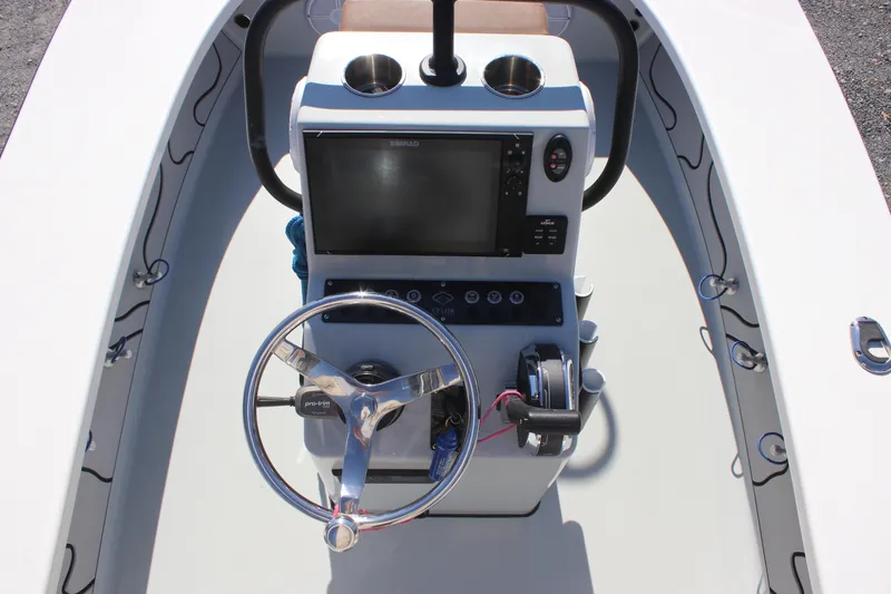 Slide: The Image of 2022 Xplor X7 boat console with steering wheel and navigation system. - 9