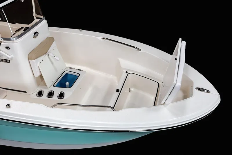 Slide: The Image of 2025 Robalo R160 Center Console boat interior with storage compartments and seating. - 10