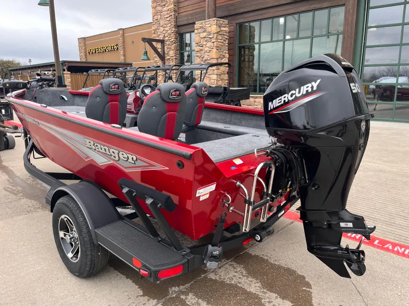 Slide: The Image of 2025 Ranger VS1665SC boat with Mercury engine, parked outdoors. - 1