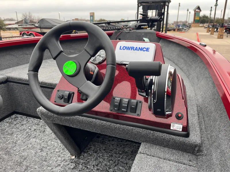 Slide: The Image of Ranger VS1665SC 2025 boat dashboard with steering wheel and Lowrance display. - 3