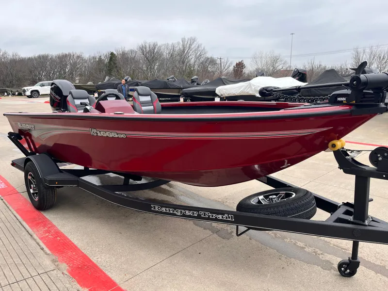 Slide: The Image of 2025 Ranger VS1665SC boat in red on a trailer, parked outdoors. - 4