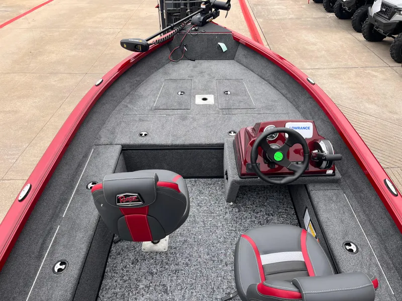 Slide: The Image of 2025 Ranger VS1665SC boat interior with red accents and modern steering console. - 7