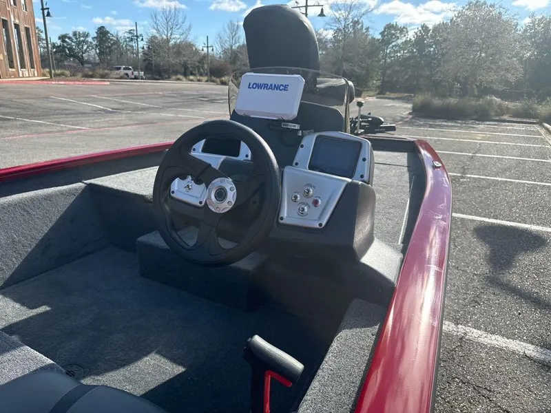 Slide: The Image of 2025 Tracker Pro Team 175 boat interior with steering wheel and Lowrance electronics. - 7