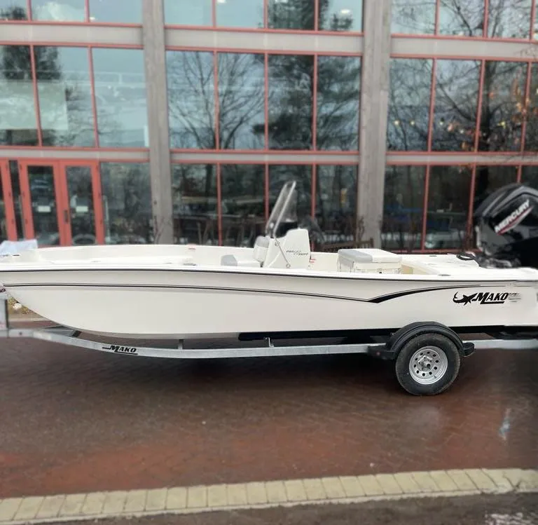 The Image of 2025 Mako Pro Skiff 17 CC boat on trailer, parked outdoors. - 0