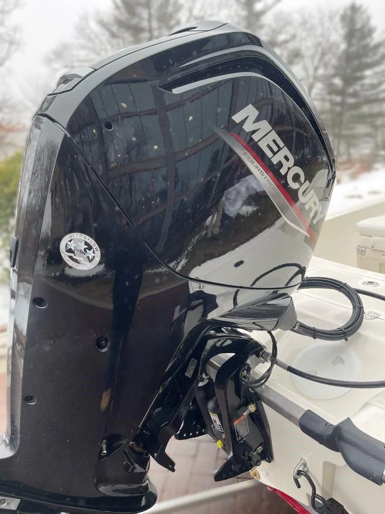 Slide: The Image of 2025 Mako Pro Skiff 17 CC with Mercury outboard motor, snowy background. - 3