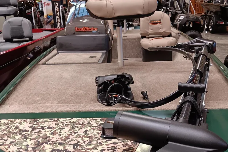 Slide: The Image of 2025 Tracker Bass Tracker Classic Limited boat interior with seating and equipment. - 2