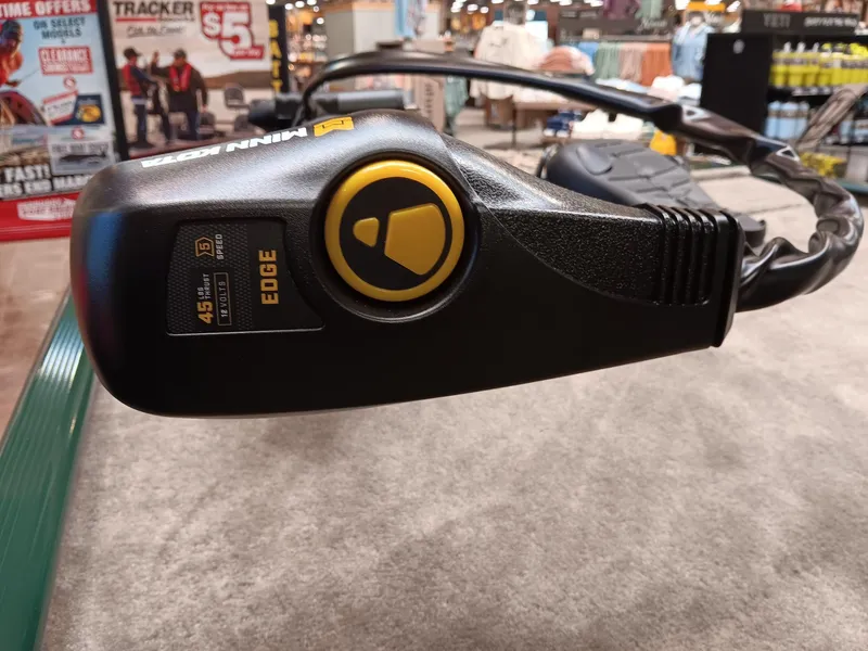 Slide: The Image of 2025 Tracker Bass Tracker Classic Limited boat control panel in a showroom display. - 6