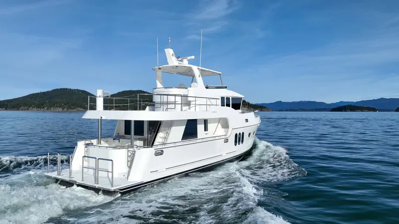 Slide: The Image of Luxurious Northwest 58 yacht cruising on serene waters, 2026 model. - 15