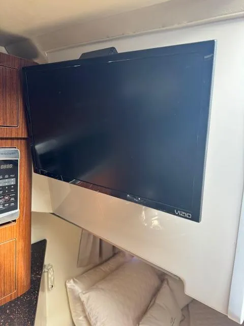 Slide: The Image of Vizio TV mounted in 2014 Regal 28 Express boat interior. - 24